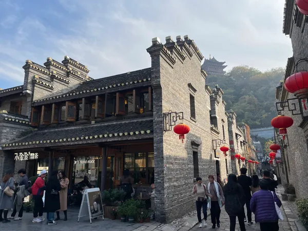 A historic gray-brick shop in Zhenjiang, decorated with red lanterns